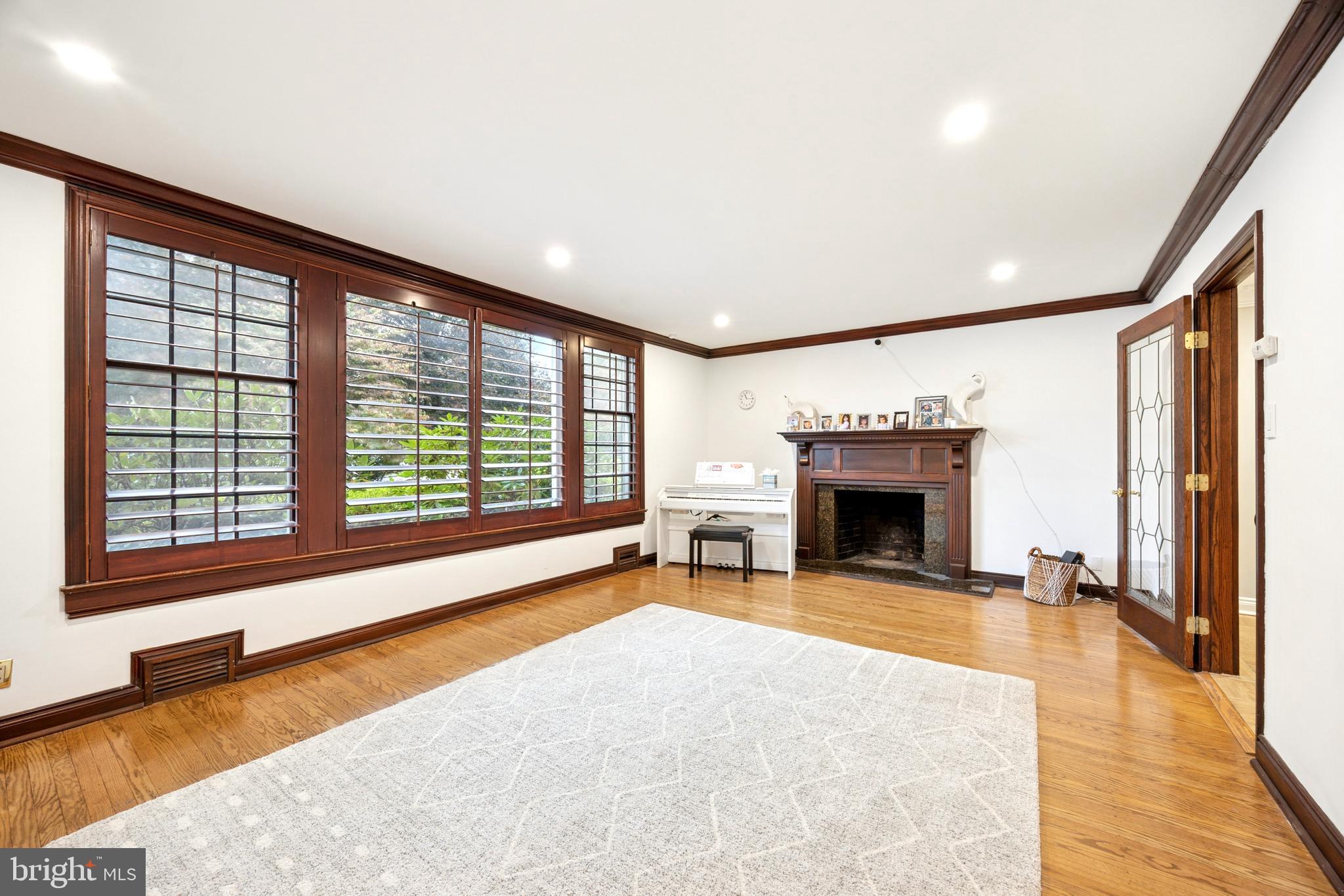1726 Riverview Road Gladwyne, PA 19035 - Photo 10 of 38 a view of an empty room with window and fire place