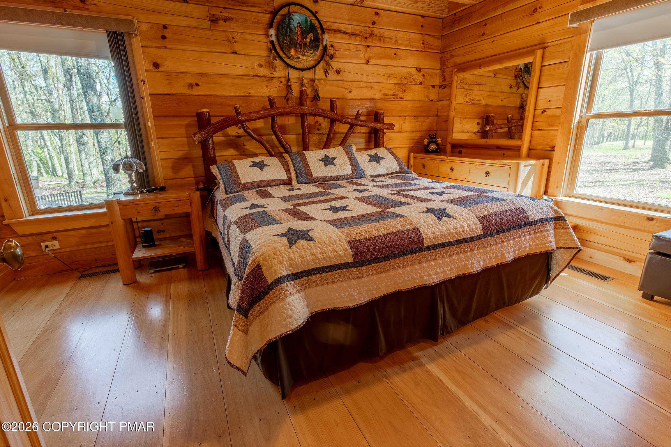 1160 Bluebird Lane Bushkill, PA 18324 - Photo 26 of 44 a bedroom with a bed and wooden floor
