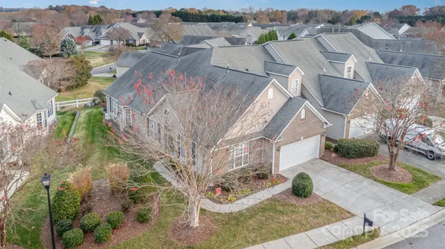an aerial view of residential house with outdoor space