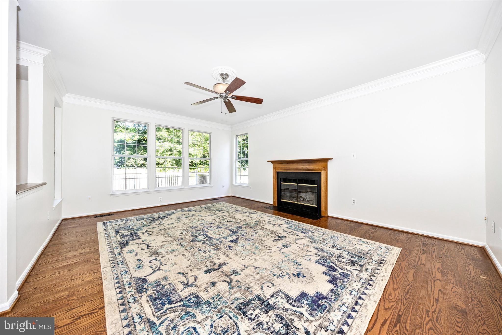 803 Apache Court Frederick, MD 21701 - Photo 14 of 46 an empty room with windows and fireplace