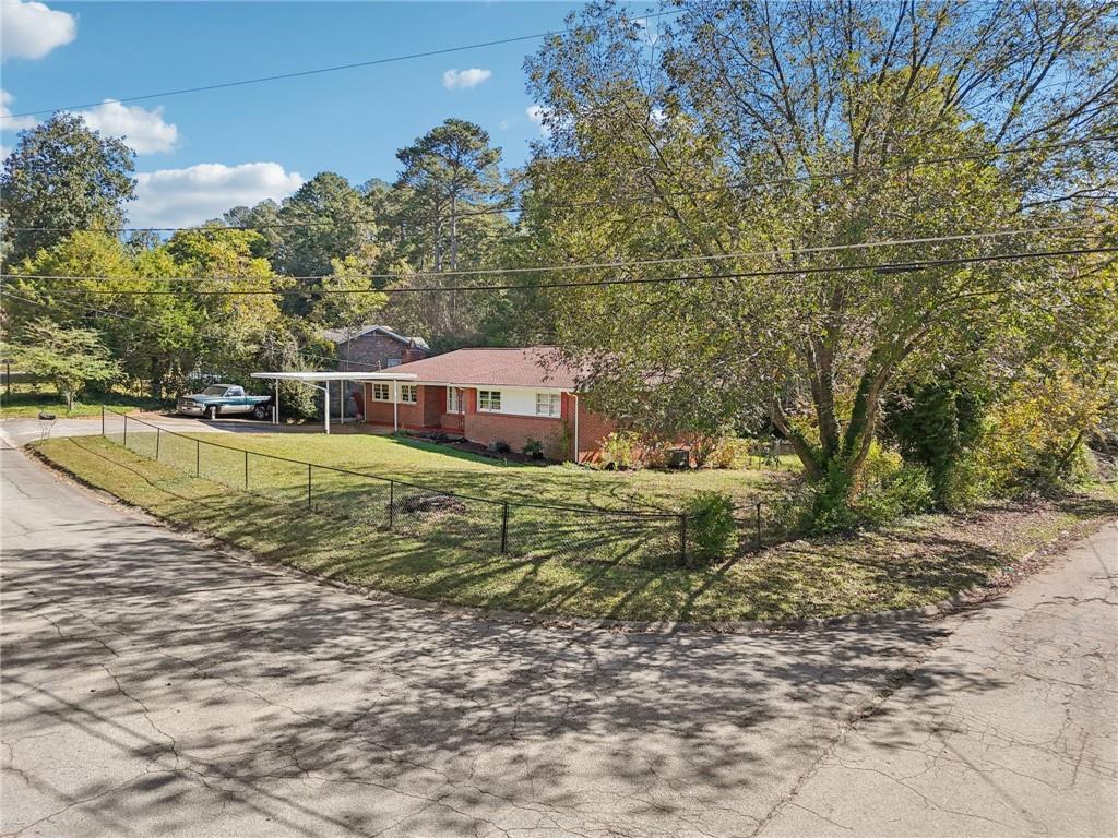 957 Texel Lane Clarkston, GA 30021 - Photo 18 of 27 a view of a house with a yard