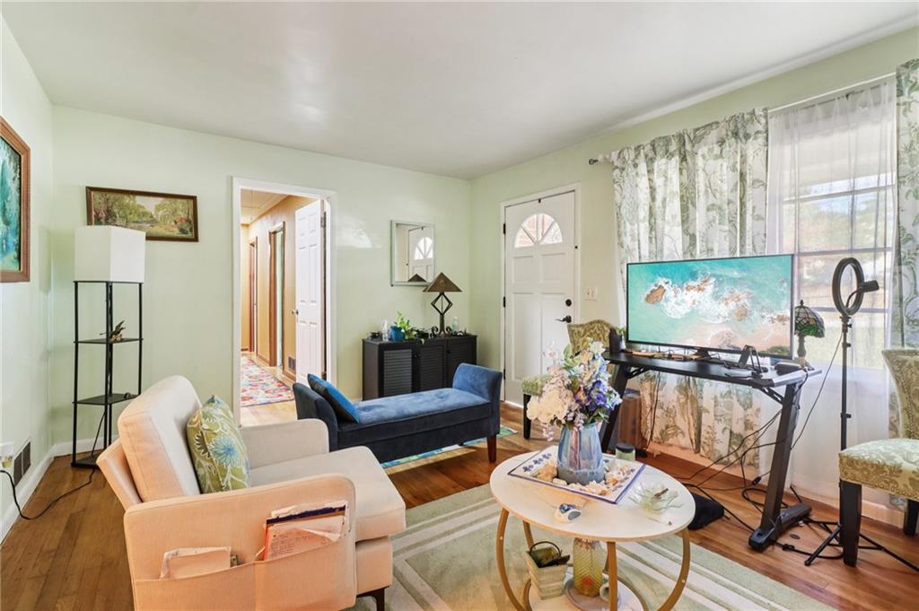 957 Texel Lane Clarkston, GA 30021 - Photo 2 of 27 a living room with furniture and a large window