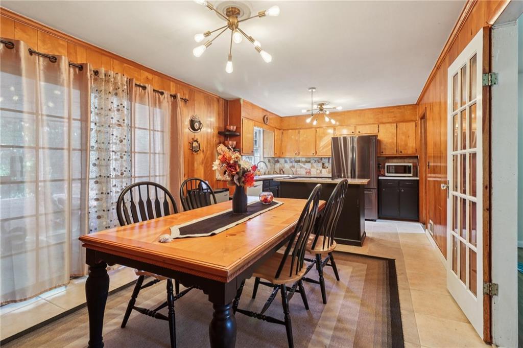 957 Texel Lane Clarkston, GA 30021 - Photo 6 of 27 a view of a a dining room with furniture window and wooden floor
