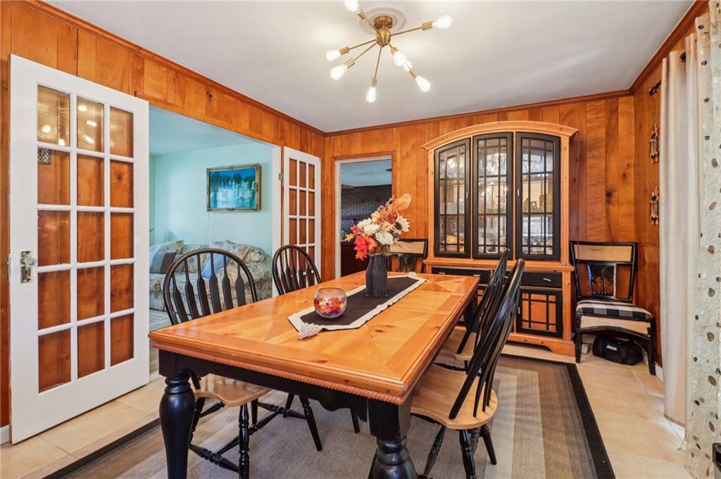 957 Texel Lane Clarkston, GA 30021 - Photo 7 of 27 a view of a dining room with furniture window and wooden floor
