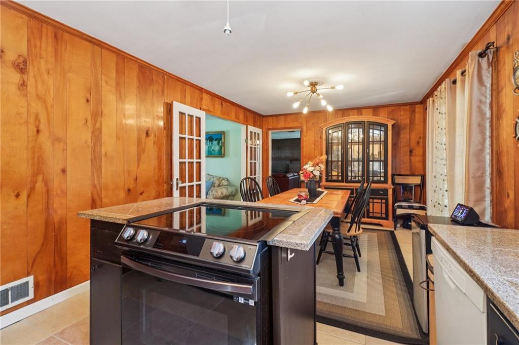 957 Texel Lane Clarkston, GA 30021 - Photo 9 of 27 a kitchen with a stove and a sink