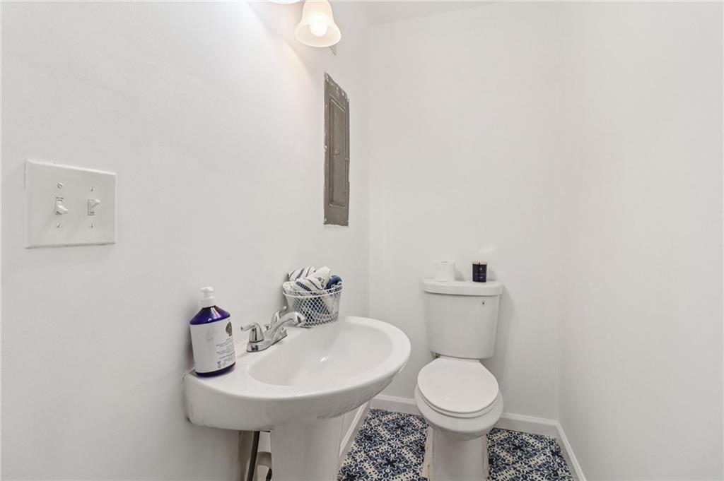 957 Texel Lane Clarkston, GA 30021 - Photo 10 of 27 a bathroom with a toilet sink and mirror