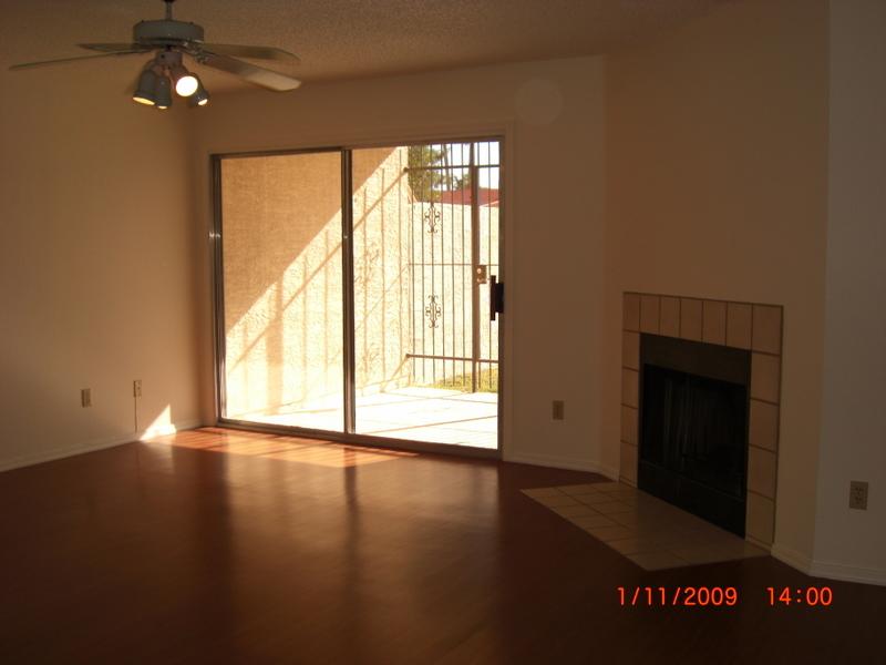 2059 East Brown Road, Unit 48 Mesa, AZ 85213 - Photo 3 of 4 Family room with fireplace