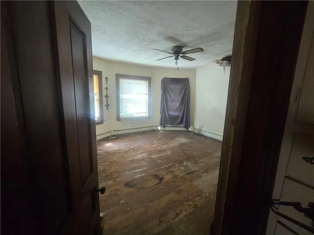 a view of livingroom with window and hardwood floor