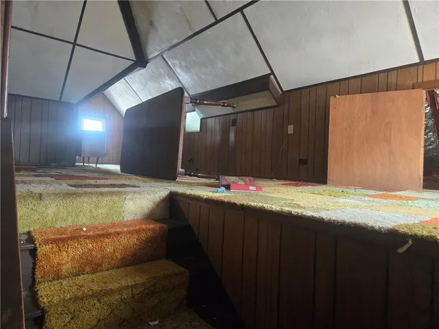 a bathroom with a tub and shower