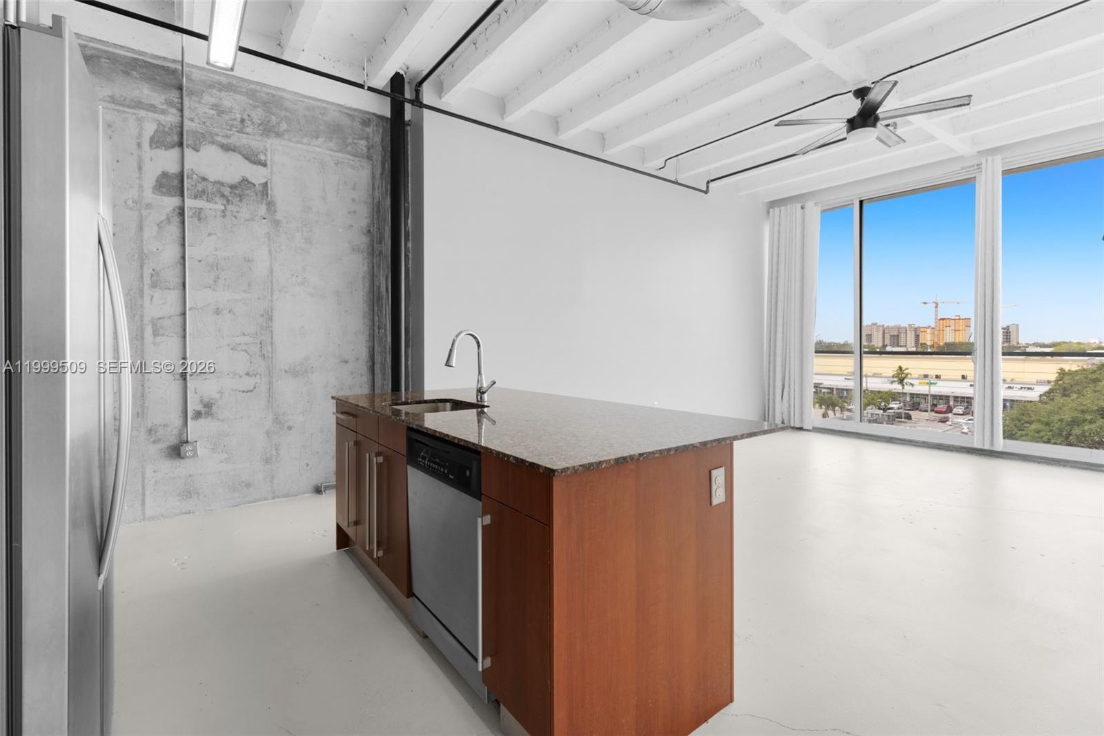 8101 Biscayne Boulevard, Unit R414 Miami, FL 33138 - Photo 5 of 27 a spacious bathroom with a granite countertop sink mirror and a bathtub
