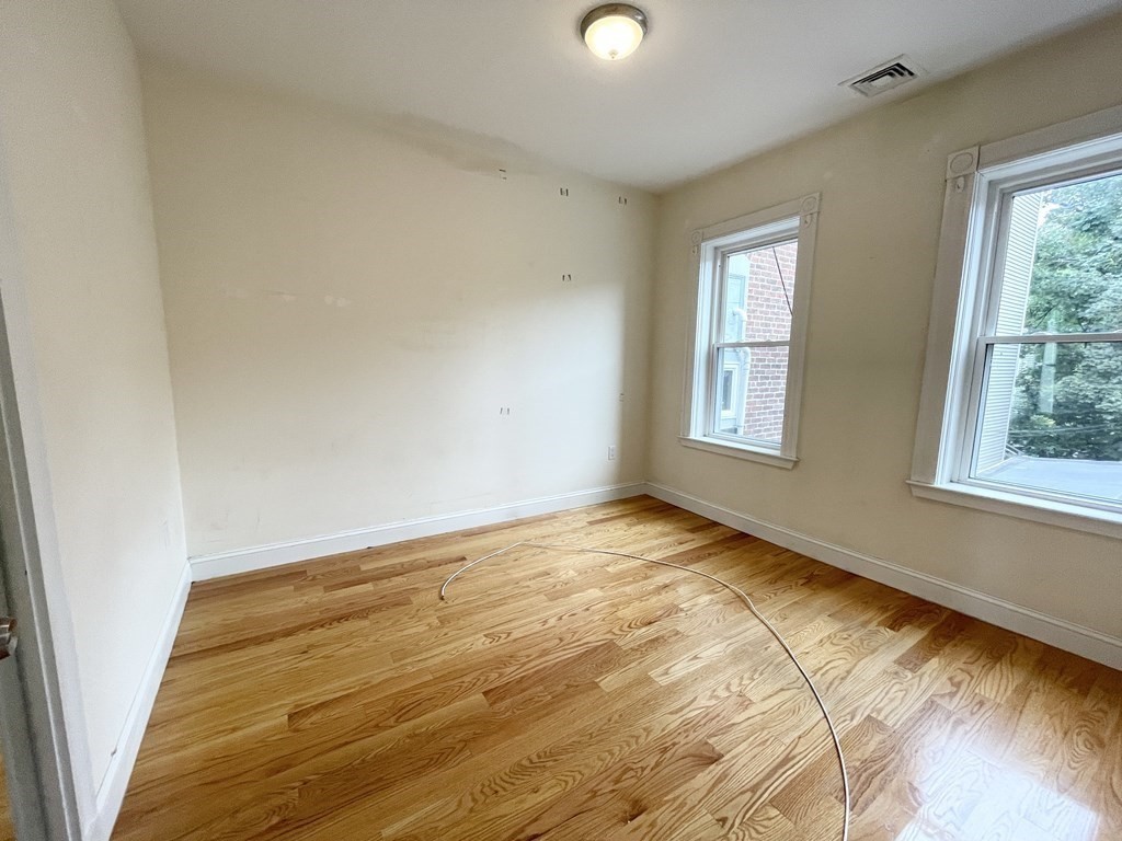 98 L Street, Unit STREET Boston, MA 02127 - Photo 10 of 19 a view of an empty room and window
