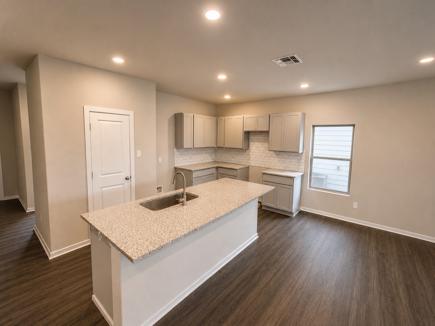 156 Wind Hill Jarrell, TX 76537 - Photo 5 of 22 a kitchen with a refrigerator a sink and wooden floor