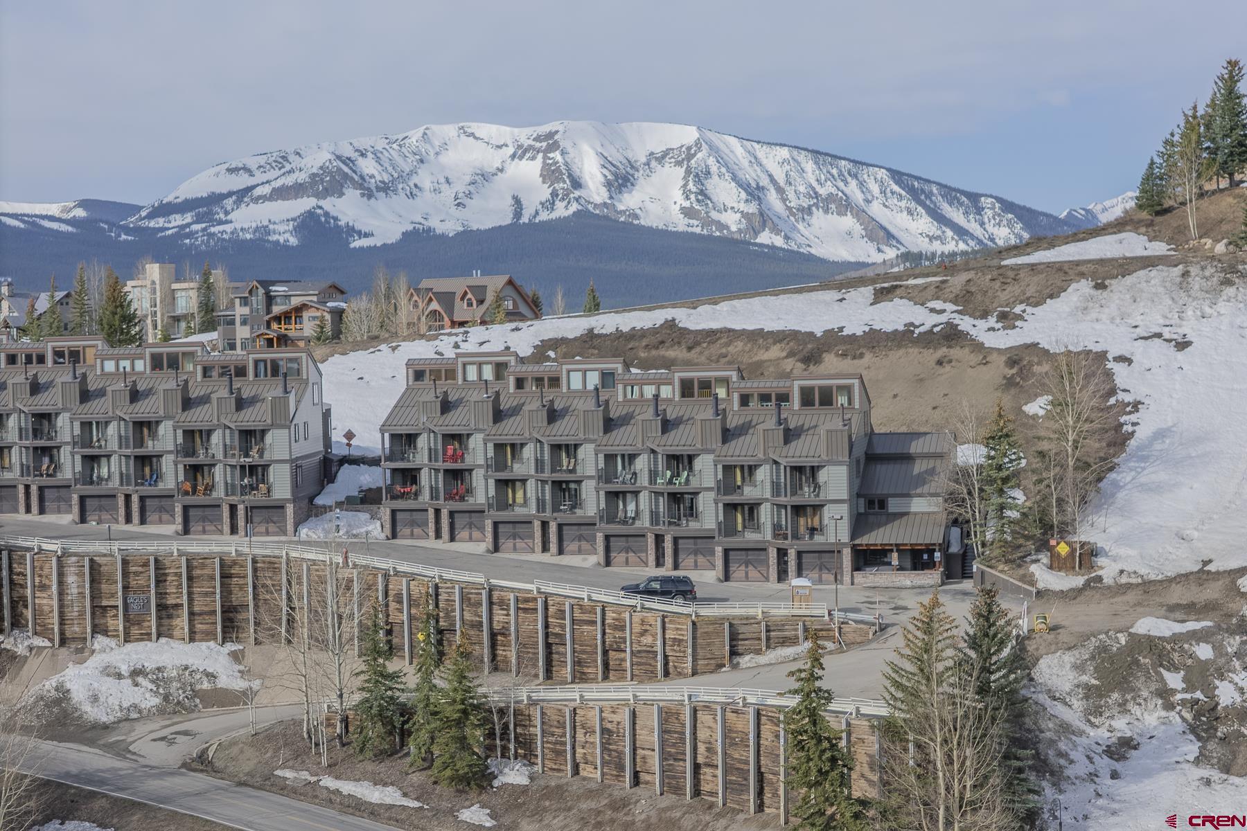 11 Morning Glory Way, Unit 14 Crested Butte, CO 81225 - Photo 1 of 44 a view of building with an outdoor space