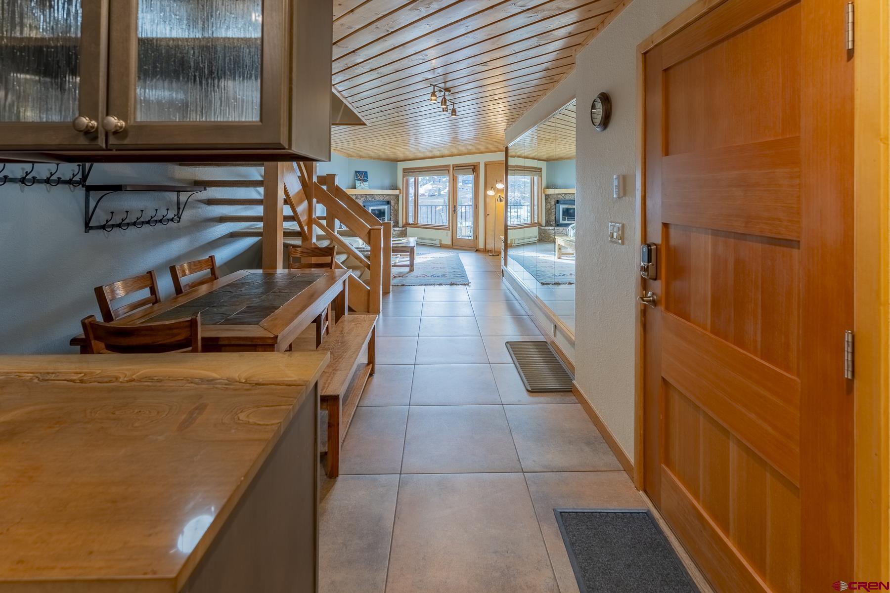11 Morning Glory Way, Unit 14 Crested Butte, CO 81225 - Photo 12 of 44 a view of entryway and hall with wooden floor