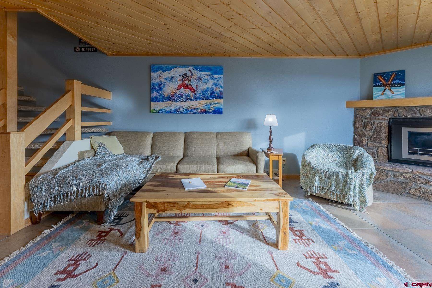 11 Morning Glory Way, Unit 14 Crested Butte, CO 81225 - Photo 18 of 44 a living room with furniture and a fireplace