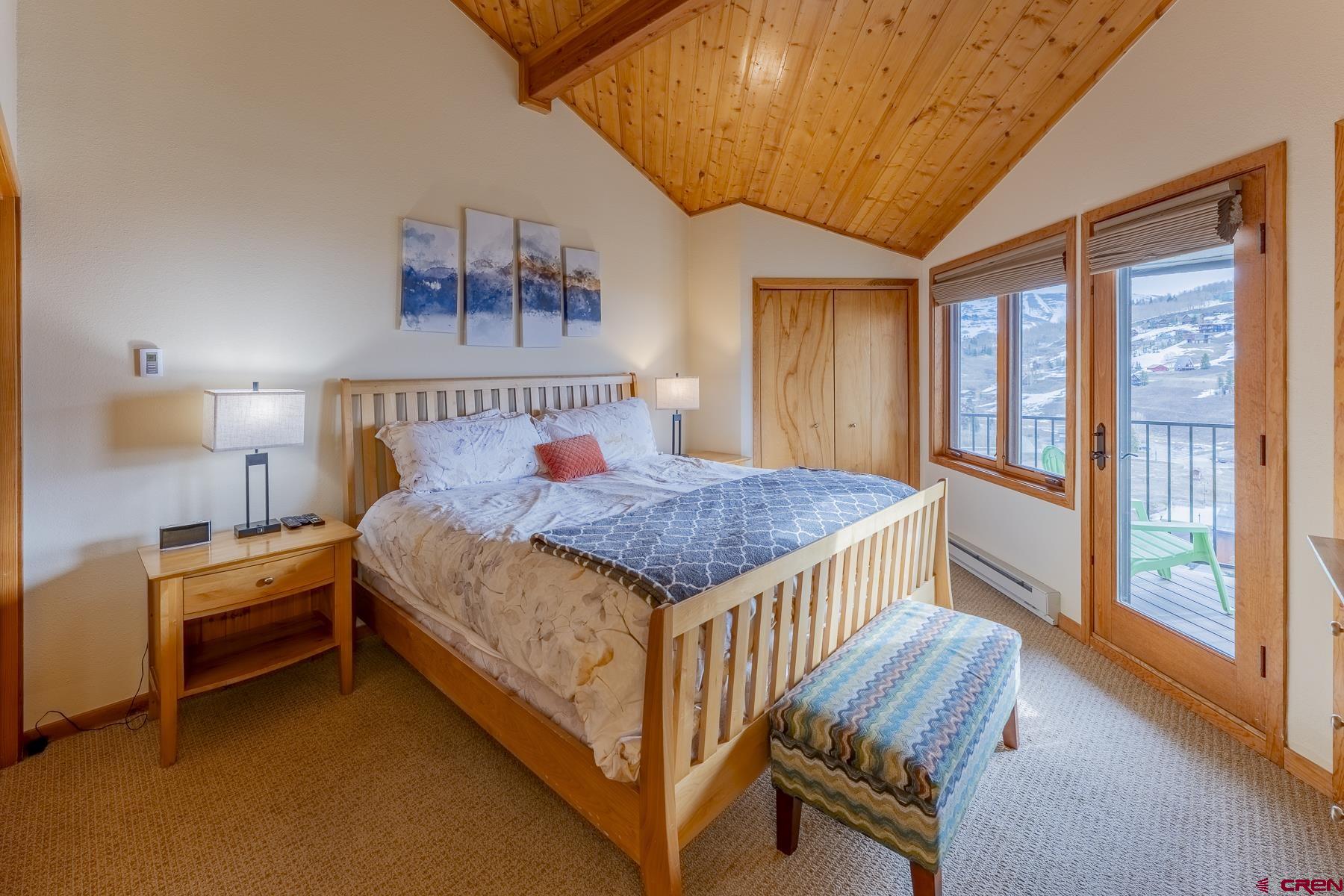 11 Morning Glory Way, Unit 14 Crested Butte, CO 81225 - Photo 23 of 44 a bed room with a bed and a large window