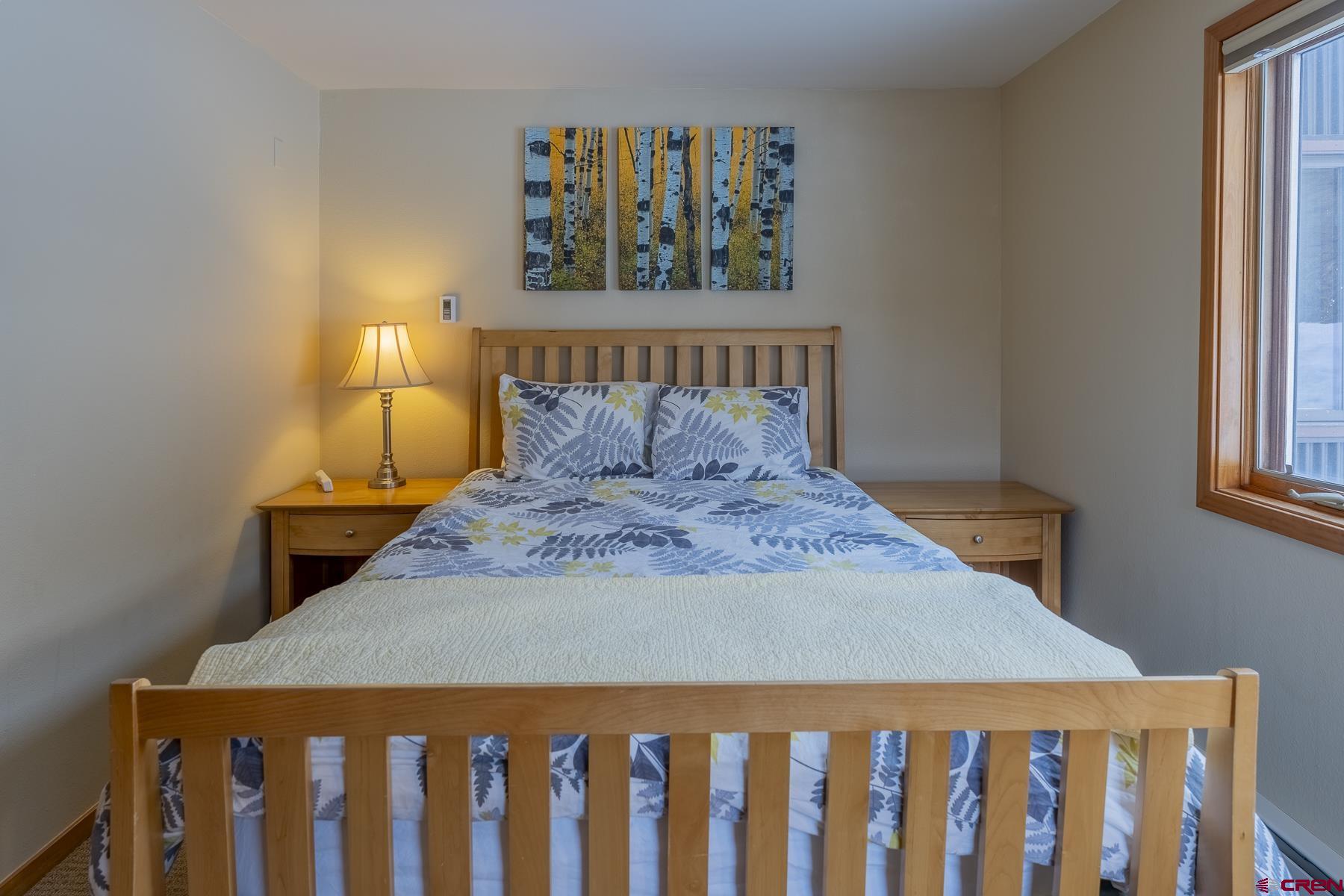 11 Morning Glory Way, Unit 14 Crested Butte, CO 81225 - Photo 28 of 44 a bedroom with a bed and a window