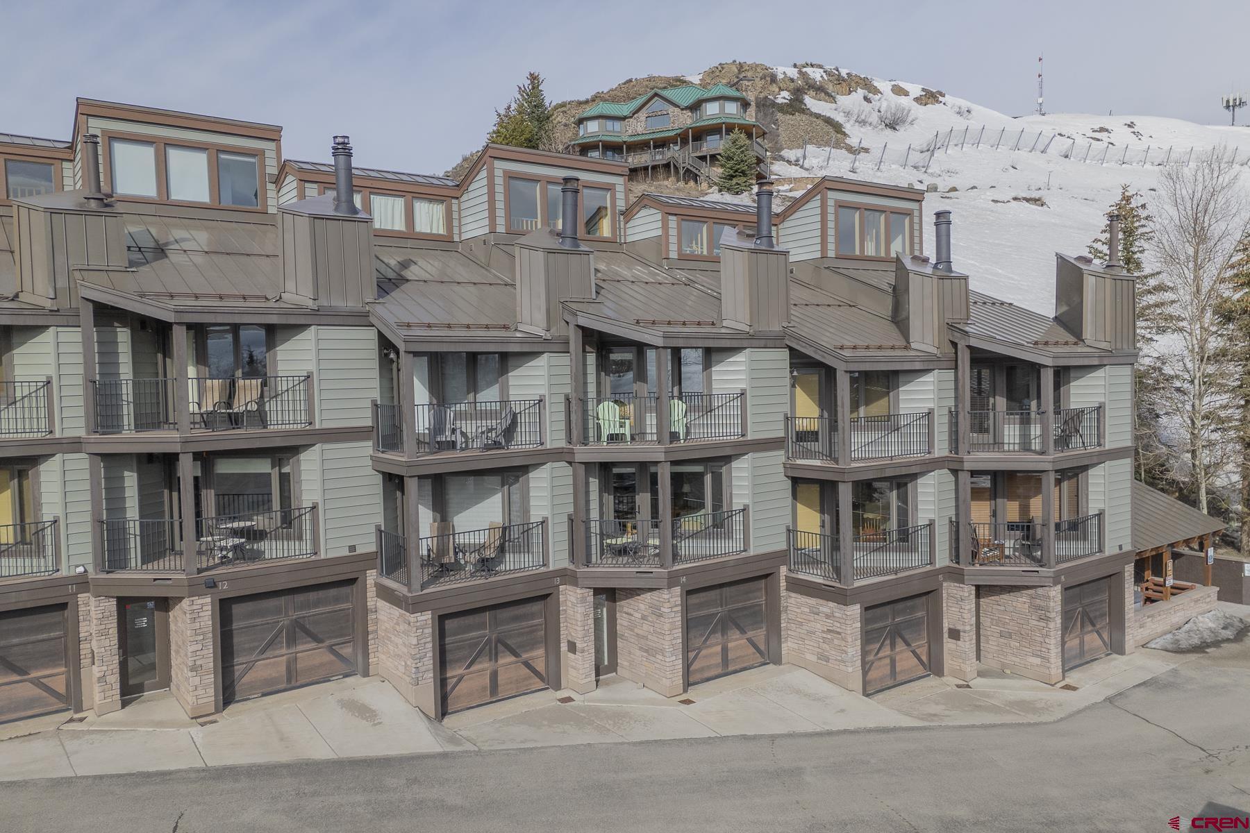 11 Morning Glory Way, Unit 14 Crested Butte, CO 81225 - Photo 36 of 44 a front view of residential houses with stairs