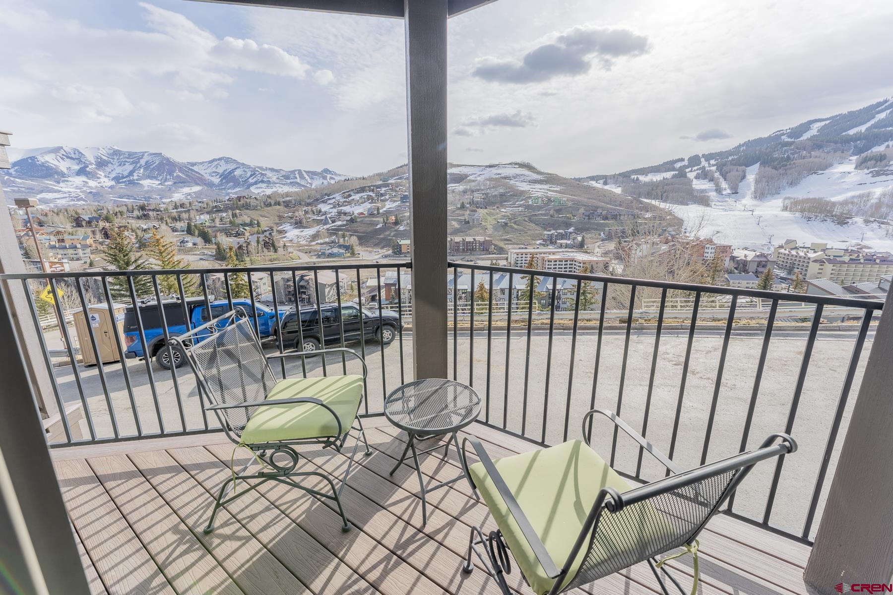 11 Morning Glory Way, Unit 14 Crested Butte, CO 81225 - Photo 44 of 44 a view of a balcony with chair and wooden floor