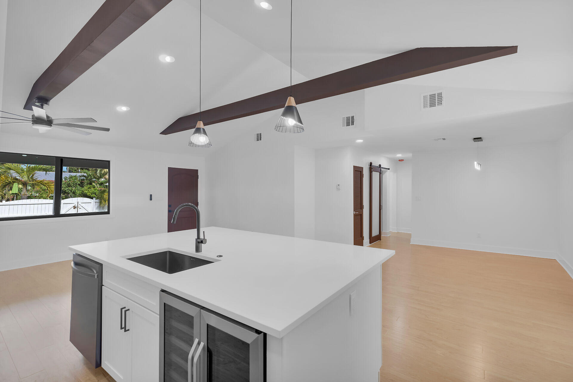 2800 Staples Avenue Key West, FL 33040 - Photo 14 of 42 a kitchen with a sink a large window and a refrigerator