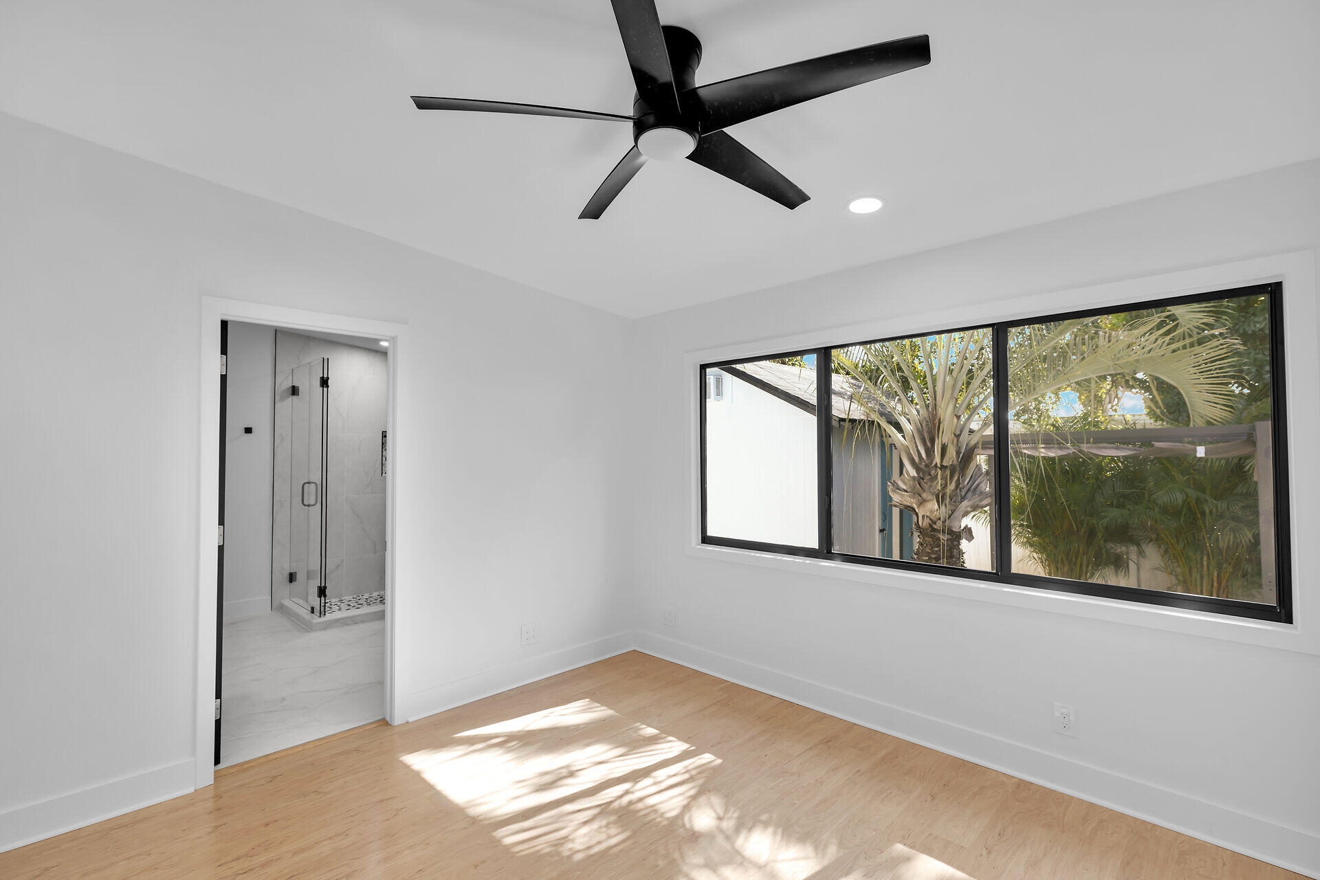 2800 Staples Avenue Key West, FL 33040 - Photo 17 of 42 a view of an empty room with a window and a ceiling fan