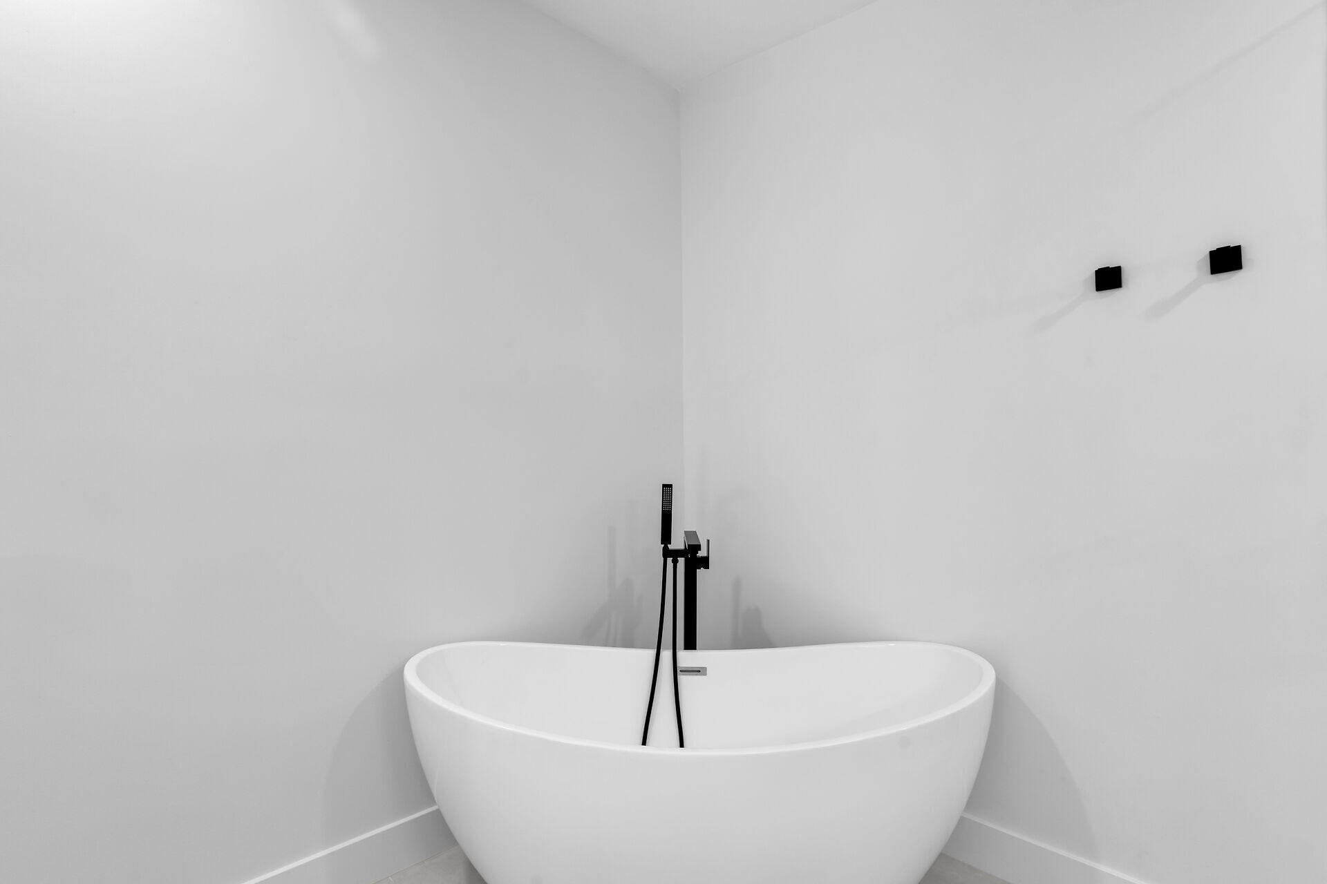 2800 Staples Avenue Key West, FL 33040 - Photo 19 of 42 a white bath tub sitting in a bathroom