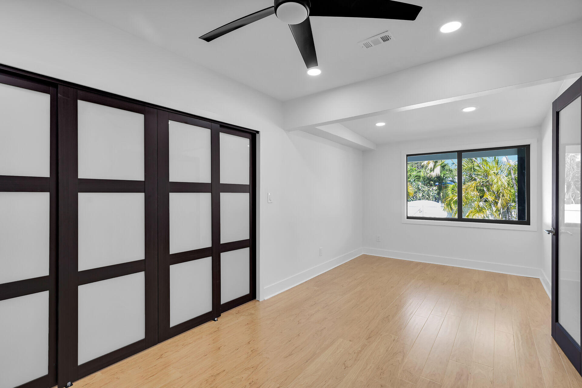 2800 Staples Avenue Key West, FL 33040 - Photo 3 of 42 wooden floor in an empty room with a window