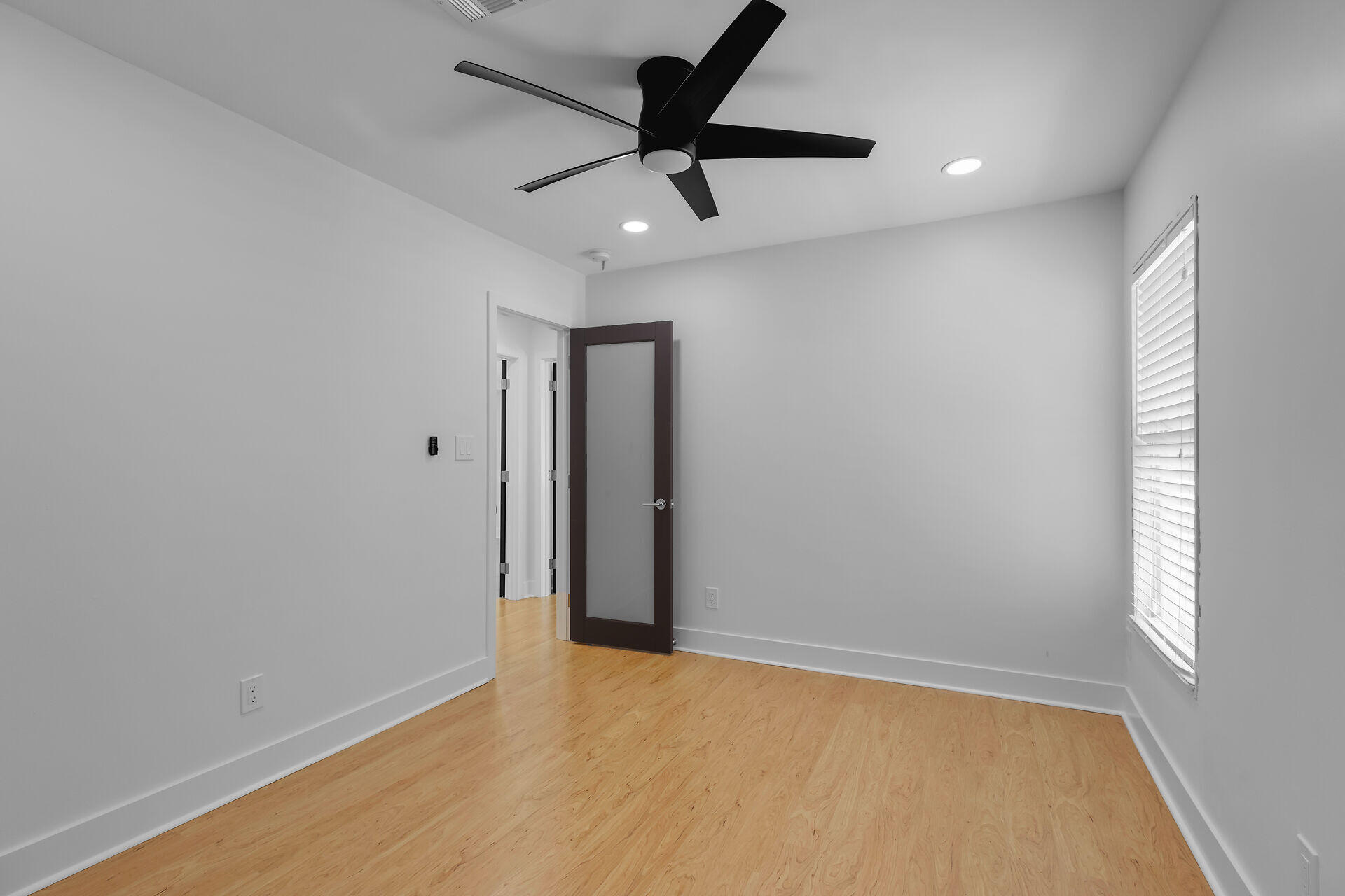 2800 Staples Avenue Key West, FL 33040 - Photo 34 of 42 wooden floor in an empty room with a window