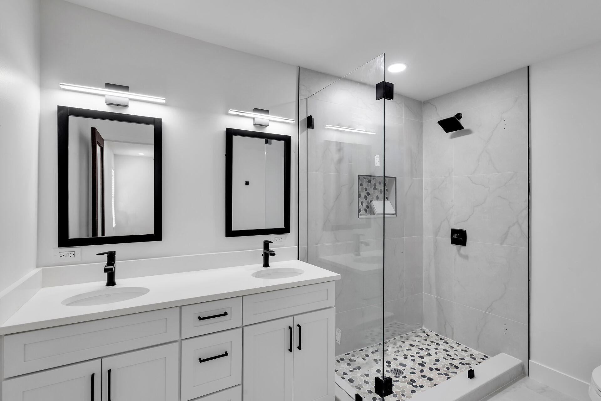 2800 Staples Avenue Key West, FL 33040 - Photo 37 of 42 a bathroom with double sink and mirror