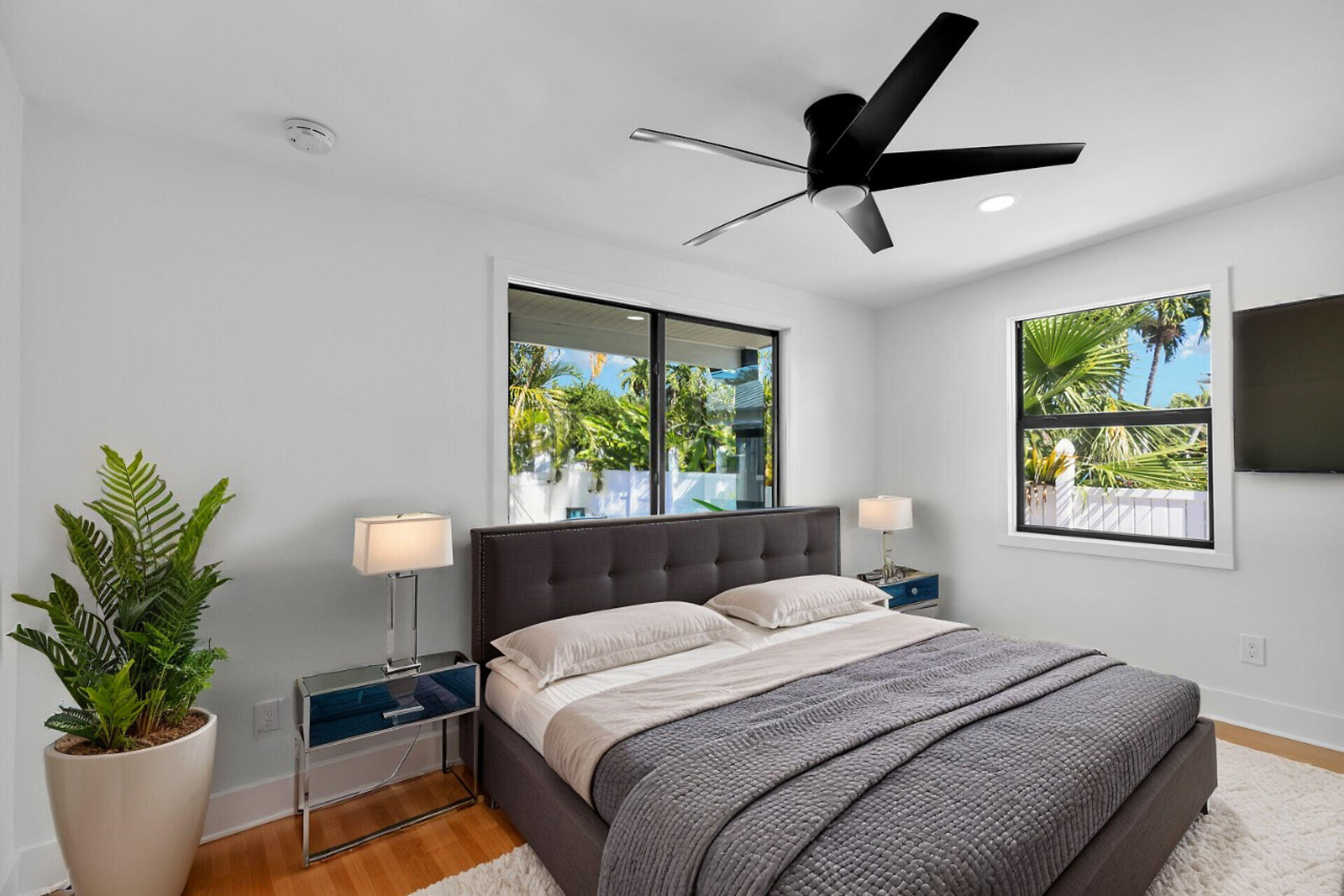 2800 Staples Avenue Key West, FL 33040 - Photo 41 of 42 a bedroom with a large bed and a potted plant