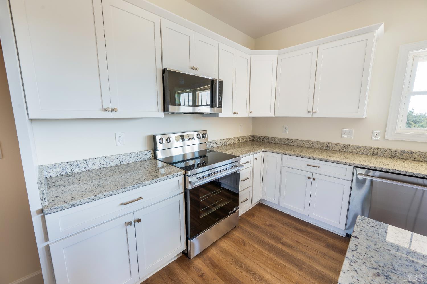 10578 Leesville Road Lynch Station, VA 24571 - Photo 13 of 54 a kitchen with white cabinets stainless steel appliances and sink