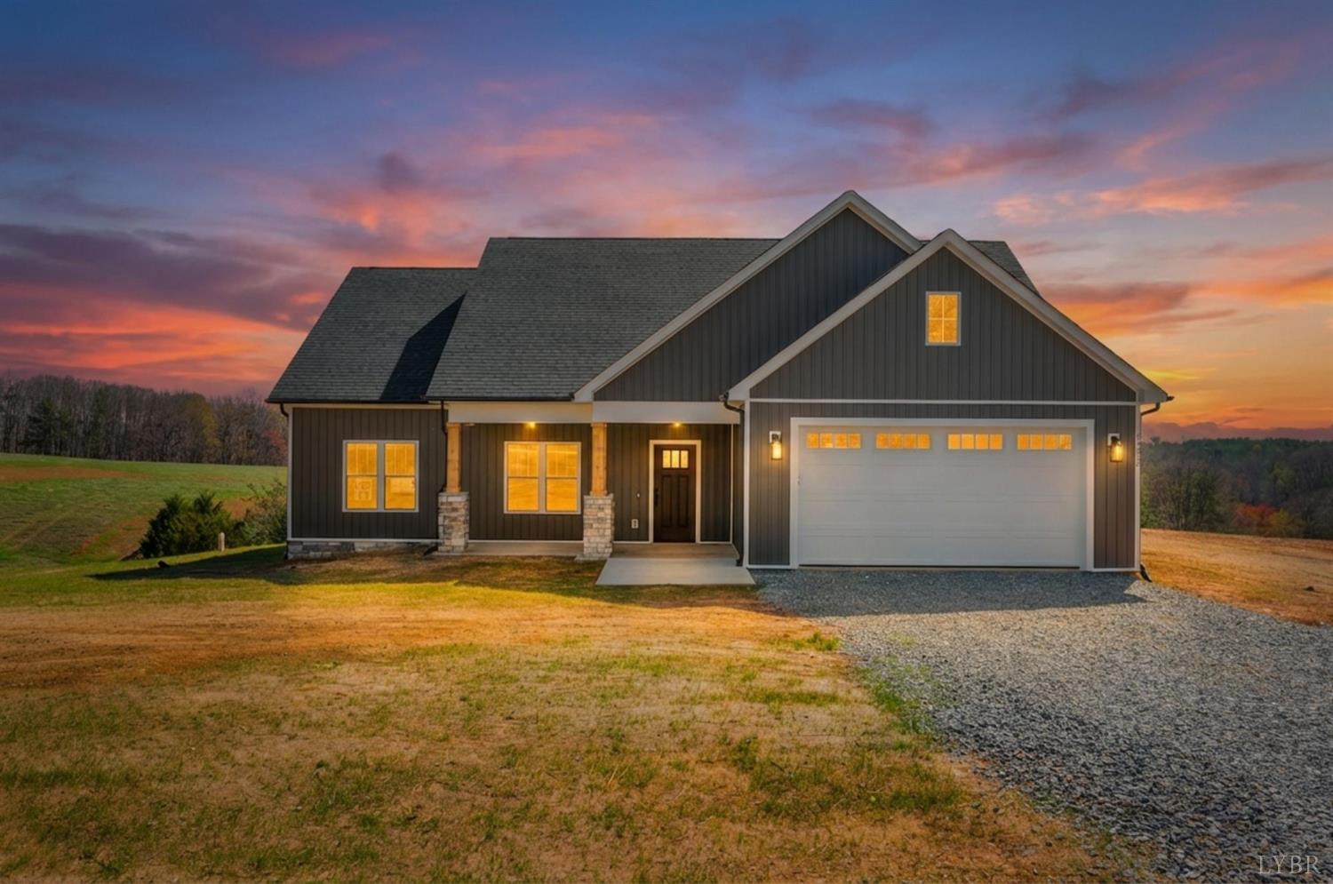 10578 Leesville Road Lynch Station, VA 24571 - Photo 2 of 54 a front view of a house with a yard and garage