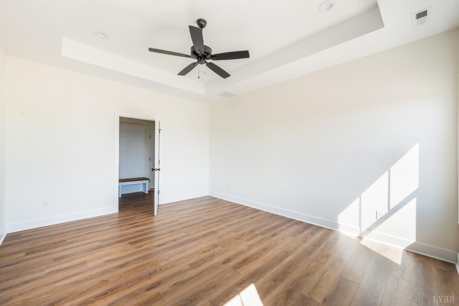 10578 Leesville Road Lynch Station, VA 24571 - Photo 21 of 54 a view of empty room with wooden floor and fan