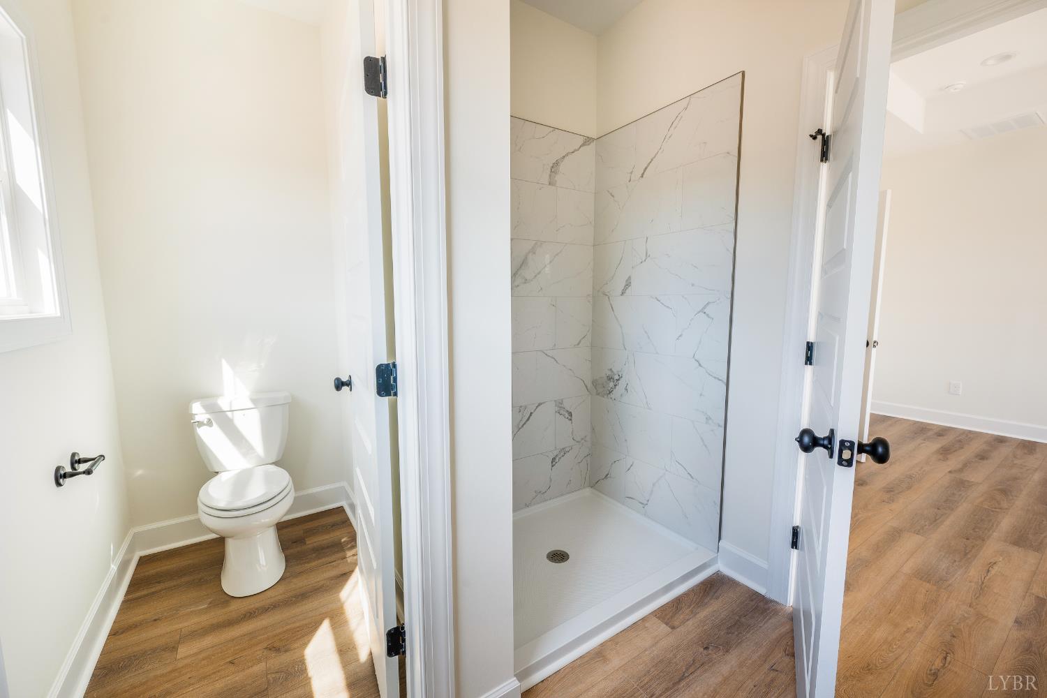 10578 Leesville Road Lynch Station, VA 24571 - Photo 24 of 54 a bathroom with a toilet and a shower