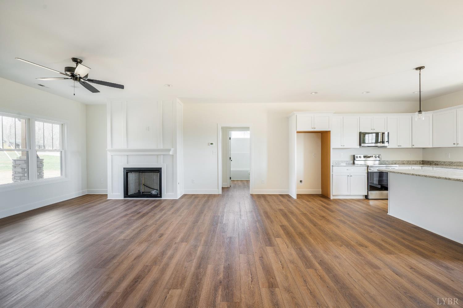 10578 Leesville Road Lynch Station, VA 24571 - Photo 27 of 54 a view of empty room with wooden floor and fireplace