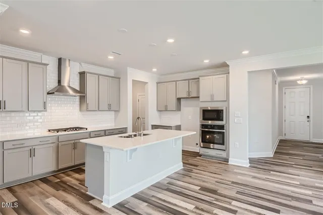 a kitchen with a sink stove and refrigerator
