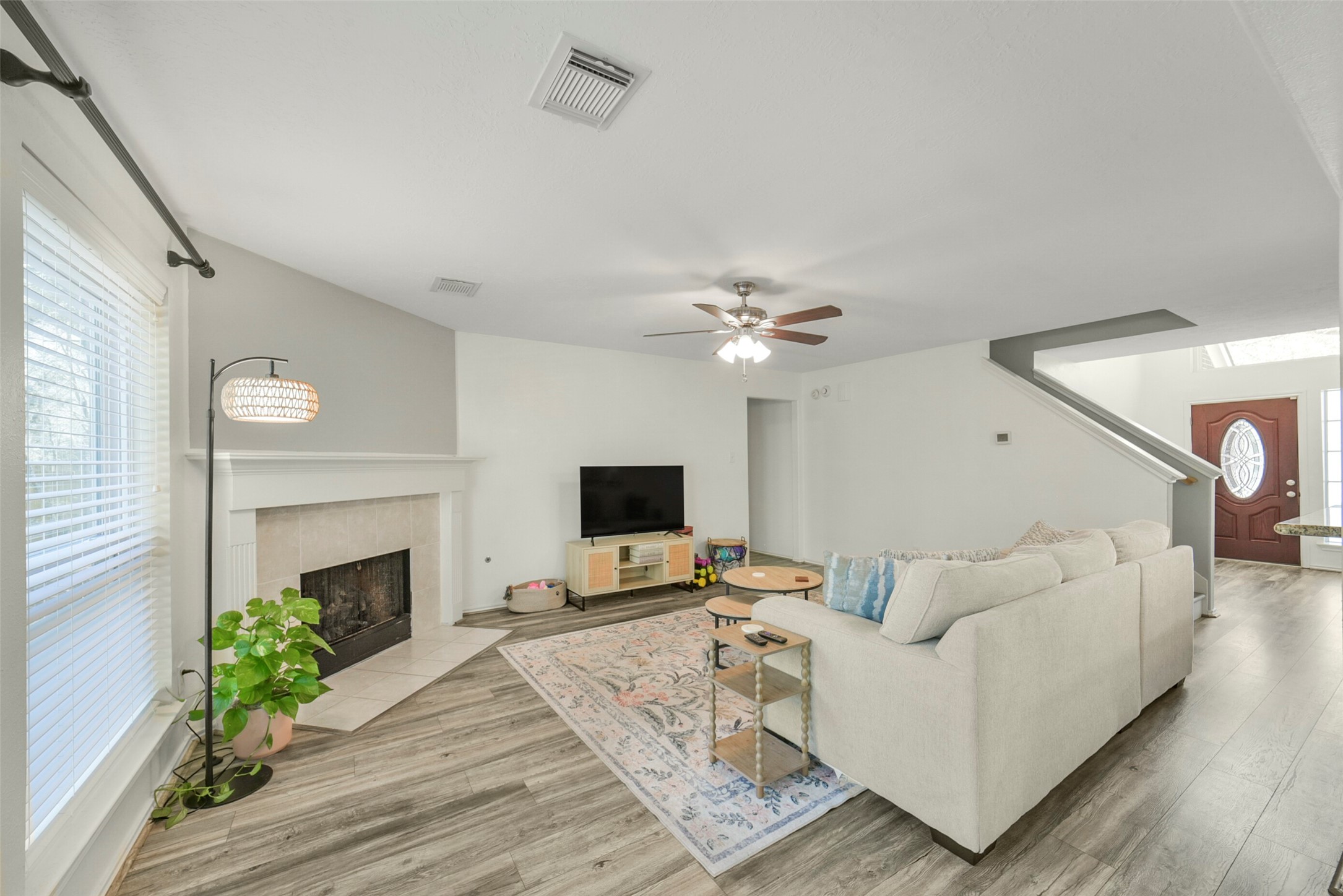 38 Tallow Hill Place Spring, TX 77382 - Photo 8 of 50 a living room with furniture a fireplace and a flat screen tv