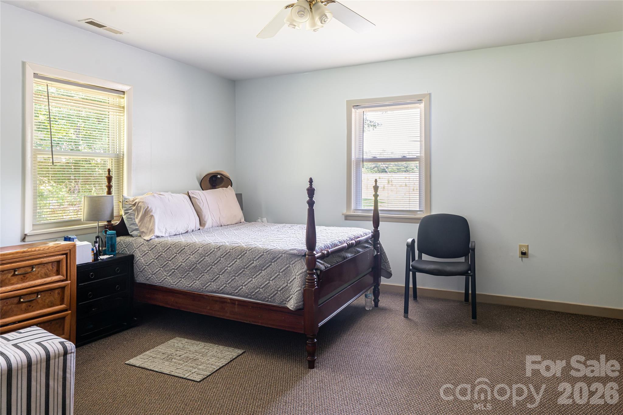 2800 Coxe Road Tryon, NC 28782 - Photo 34 of 40 a bedroom with a bed chair and a window