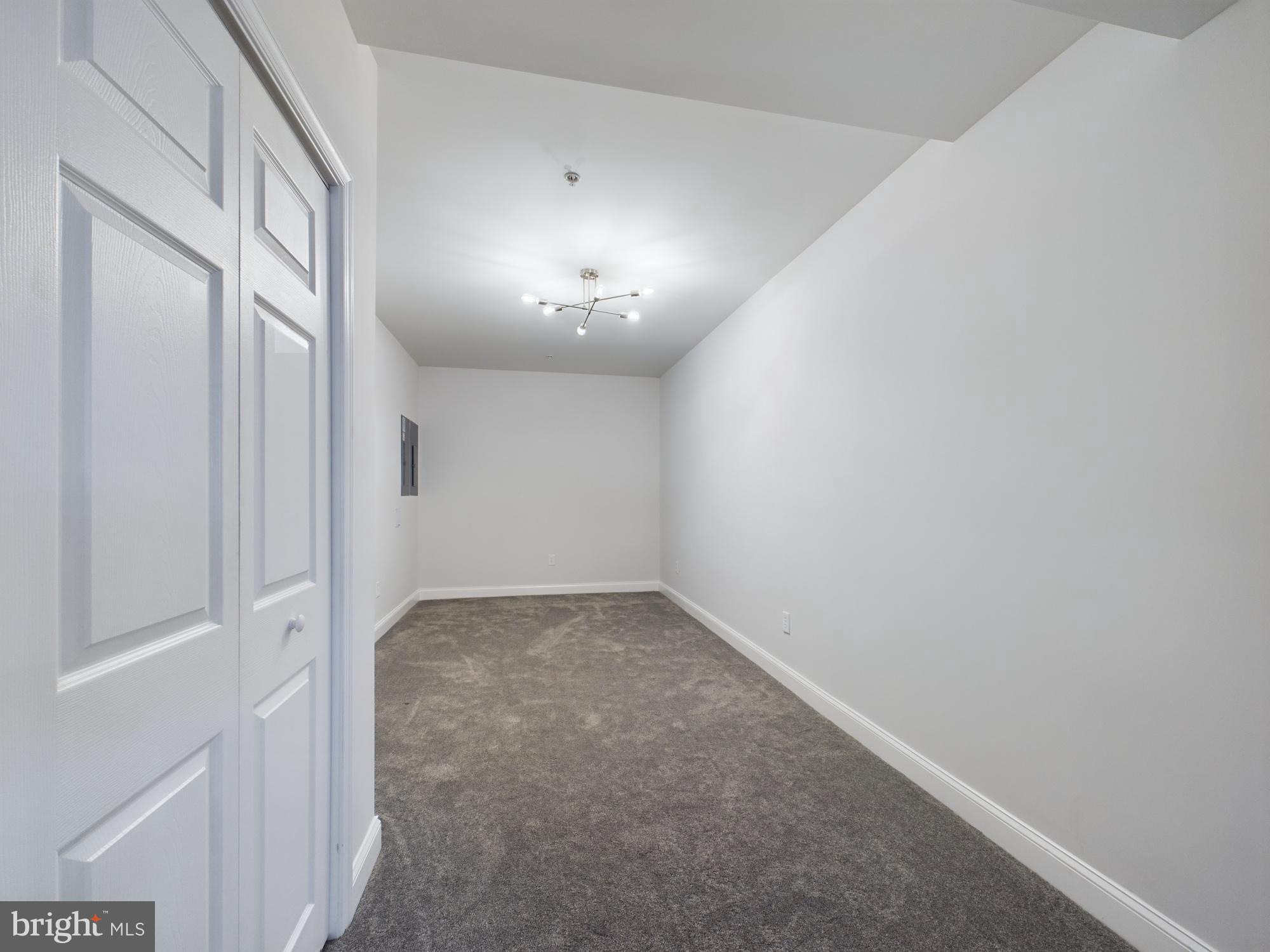14601 Driftwood Road Bowie, MD 20721 - Photo 62 of 90 Spacious room with modern lighting design.