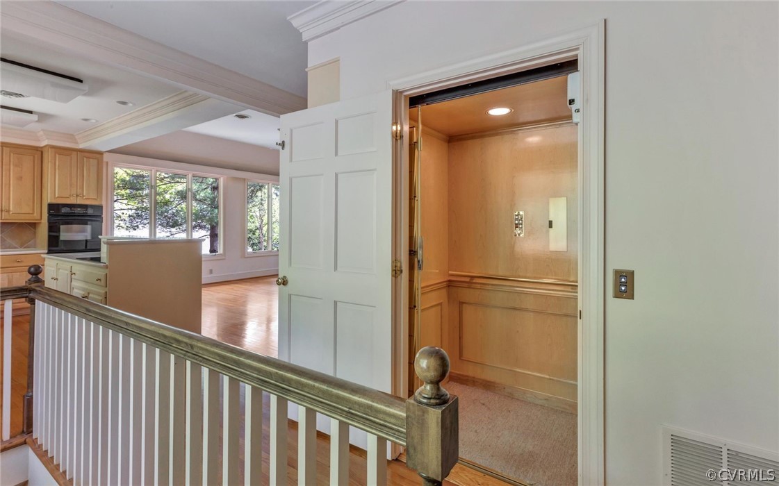8911 Highfield Road Henrico, VA 23229 - Photo 17 of 43 Elevator and back stairs to the lower level.