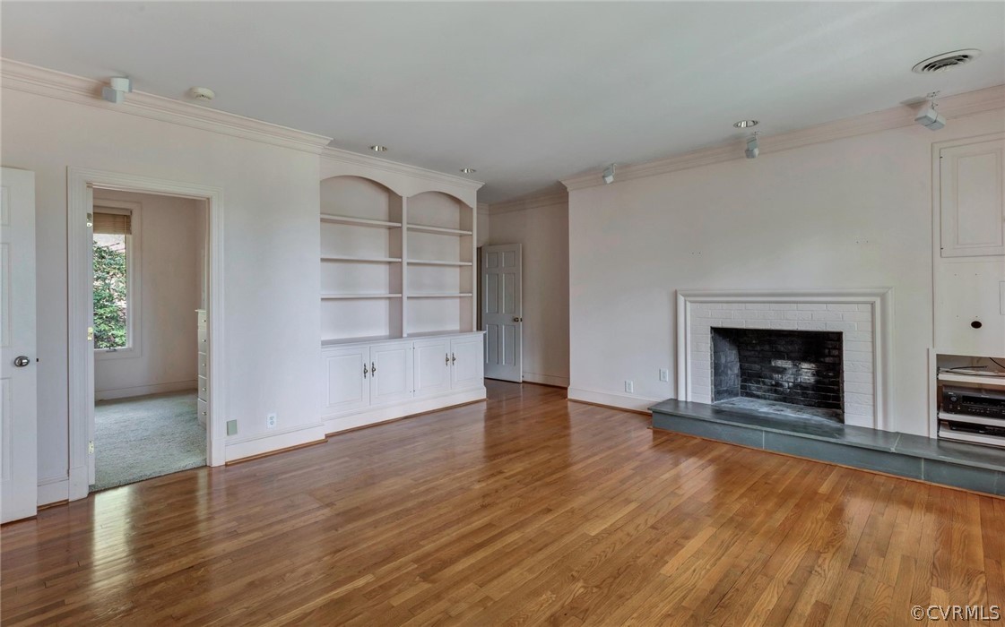 8911 Highfield Road Henrico, VA 23229 - Photo 18 of 43 Master bedroom with fireplace, hardwood floors and
