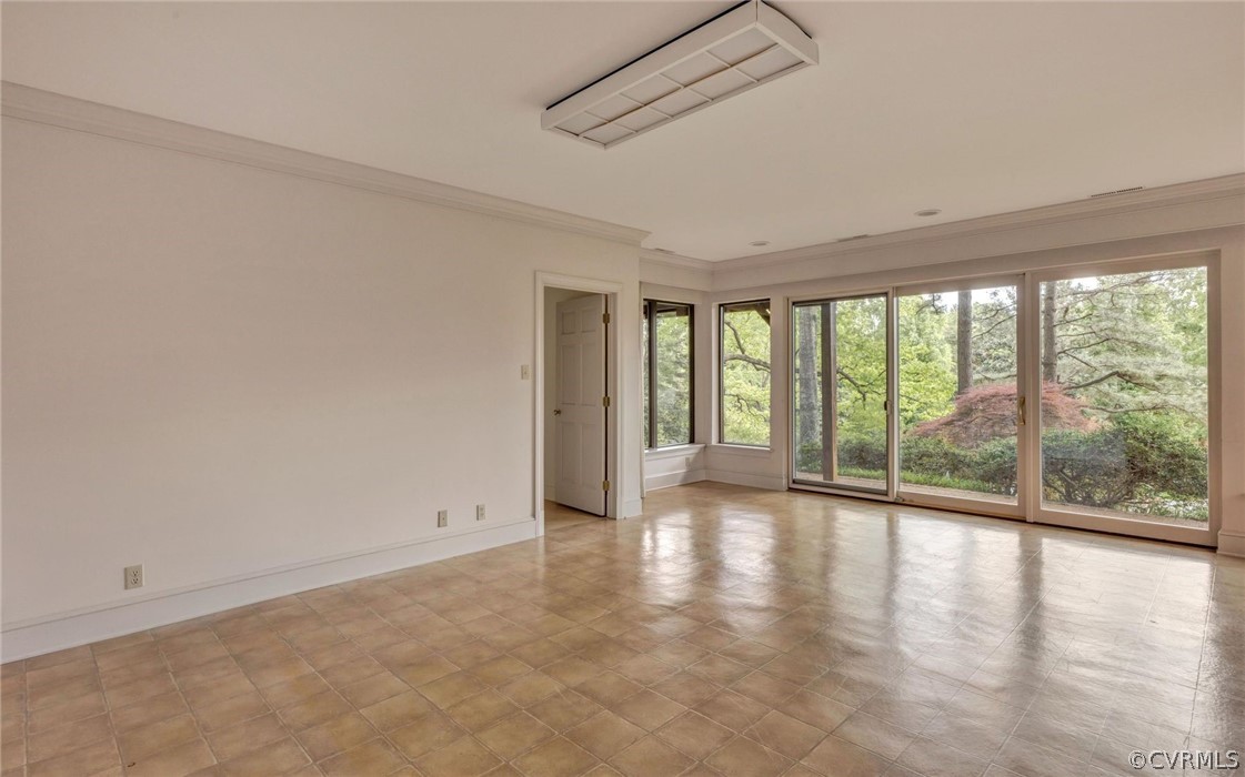 8911 Highfield Road Henrico, VA 23229 - Photo 28 of 43 Rec room with view to the back yard and arts/craft