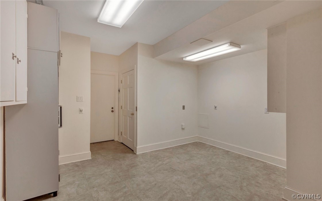 8911 Highfield Road Henrico, VA 23229 - Photo 30 of 43 Workshop with door to the garage and the elevator.