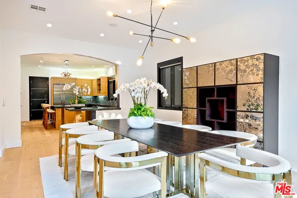 a outdoor space with furniture and a view of kitchen