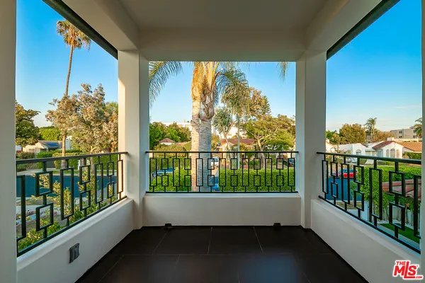 a bathroom with a sink a mirror and next to a window
