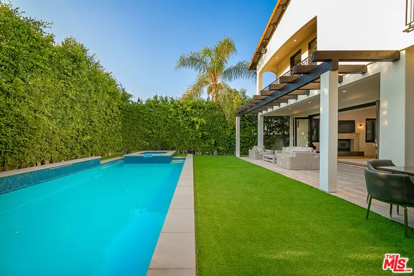 a view of an chairs and table in the patio