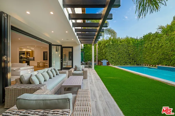 a living room with furniture and a yard