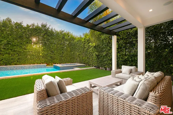 a view of swimming pool and lounge chair