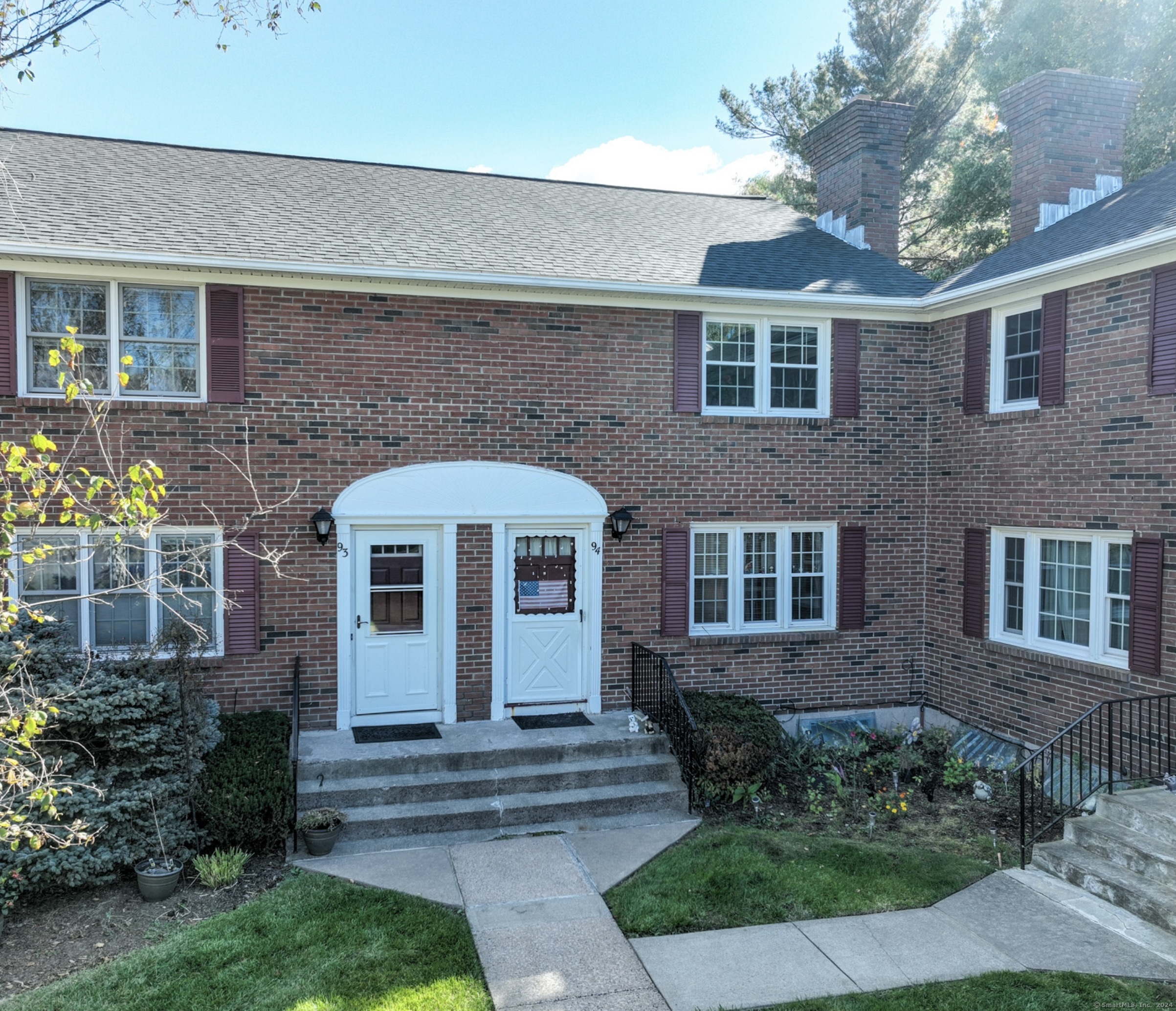 94 Brandywine Lane, Unit 94 Suffield, CT 06078 - Photo 1 of 1 a front view of a house with garden