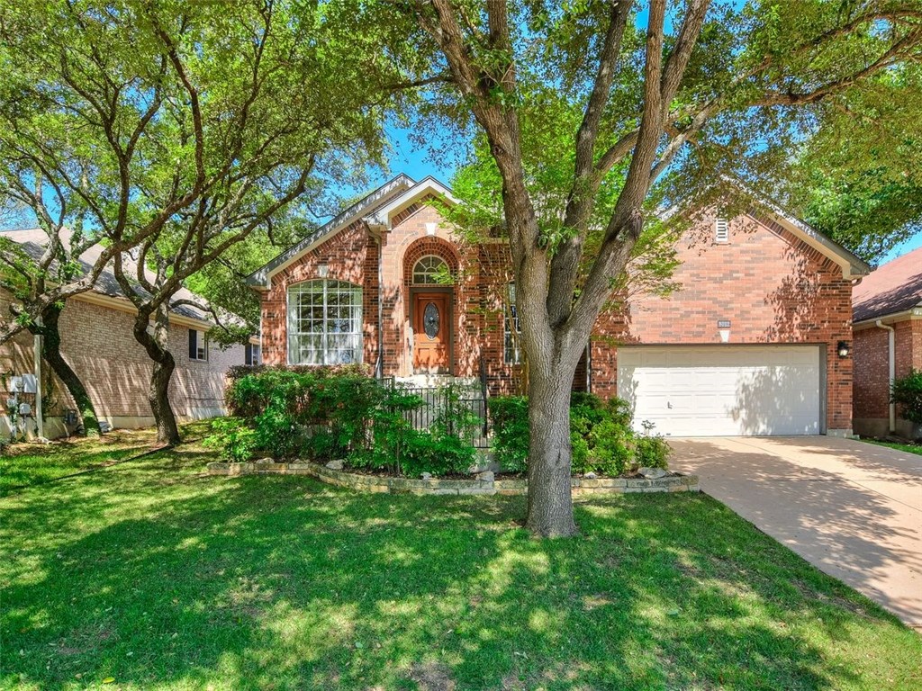 8012 Davis Mountain Pass Austin, TX 78726 - Photo 1 of 1 a front view of a house with a yard and tree